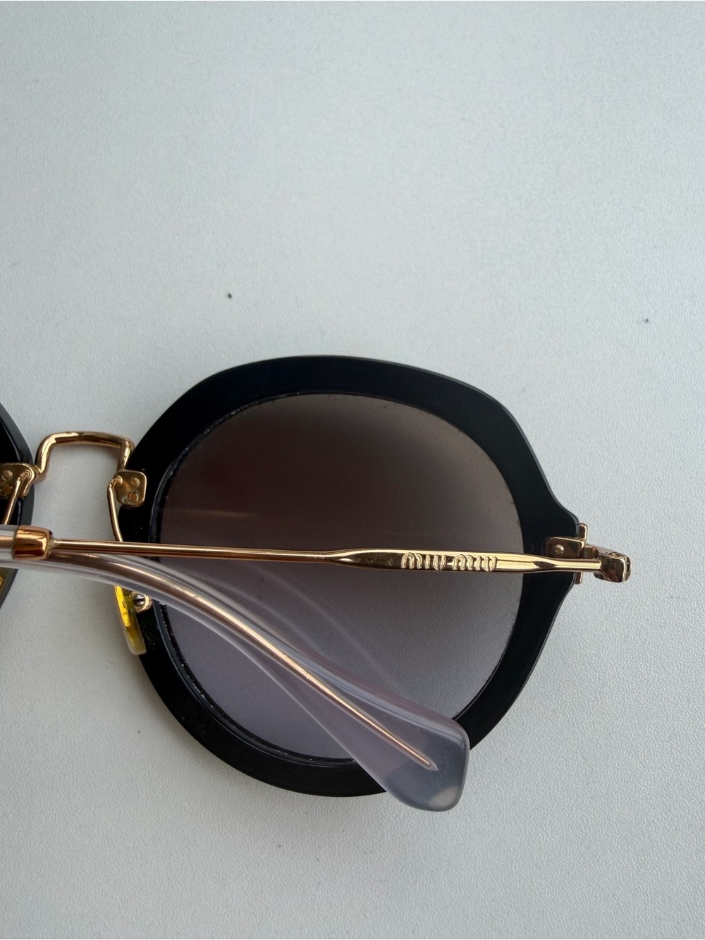 Miu Miu Women's Black Round Sunglasses with Gold Bridge - Picture 3 of 3